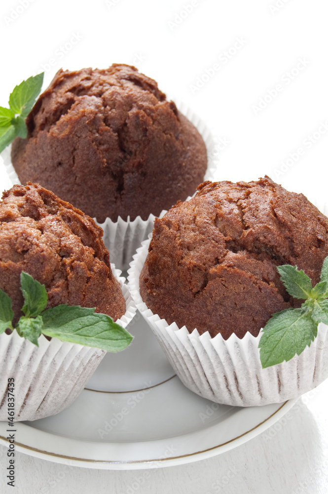 Chocolate muffin with fresh mint Chocolate muffin with fresh mint