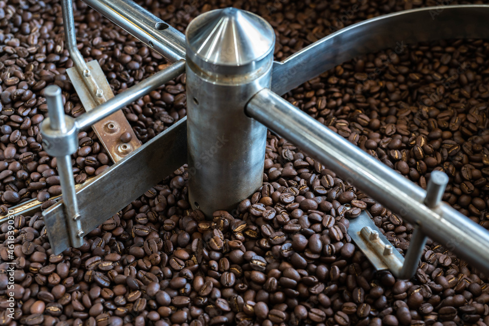 dark roast coffee beans Mixing roasted coffee , coffee roasting machine background texture dark roast coffee beans Mixing roasted coffee , coffee roasting machine background texture