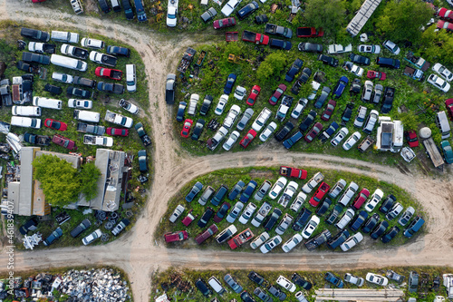 Aerial top down view of scrap cars in a park