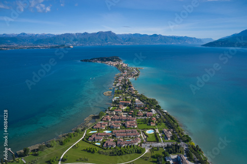 Panoramic aerial view of the Sirmione peninsula on Lake Garda, Italy. Parco San Vito in Colombare, Sirmione. Sirmione, lake garda in the background of the alps.