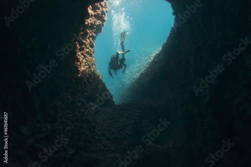 Rear view of cave diver underwater