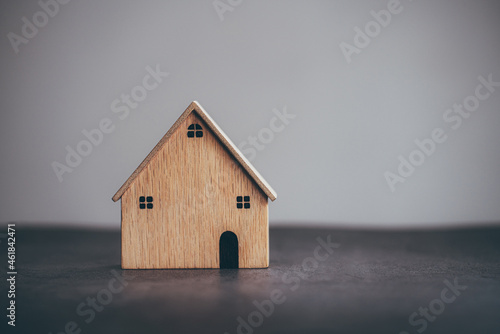 House wood model on table background, Planning to buy property, vintage tone.
