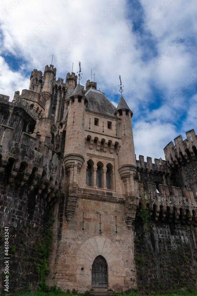 main facade of butron castle on a cloudy day