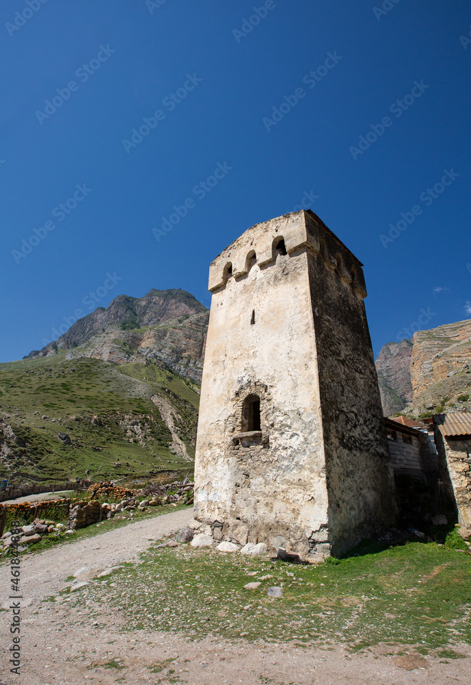 Stone tower of the Balkarukovs in the village of Eltyubu in Kabardino-Balkaria in summer