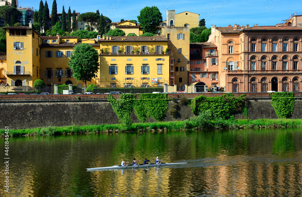 Sport activity on Arno river, residential historic townhouses along Lungarno Torrigiani, Florence, Tuscany, Italy, Europe