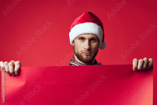Cheerful man in New Year's clothes advertising copy space isolated background © SHOTPRIME STUDIO