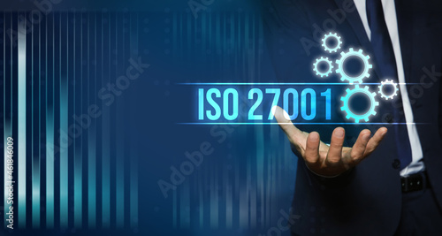 Man demonstrating virtual icon with text ISO 27001, closeup. Banner design