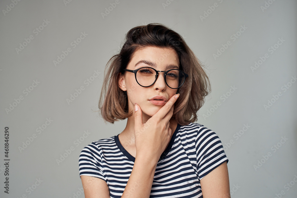woman in a striped T-shirt modern style hairstyle woman in a striped T-shirt modern style hairstyle