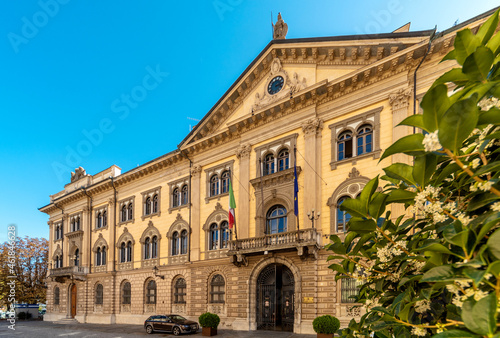 Cuneo, Piedmont, Italy - October 6, 2021: The building Prefecture Cuneo (designed by Pietro Carrera 1882) in street Rome, majestic neoclassical building at the beginning of via Roma photo