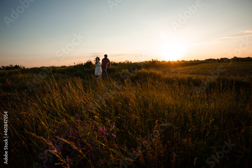 Lovely couple walking in the summer field © oksix