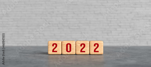 wooden cubes with message 2022 on concrete background