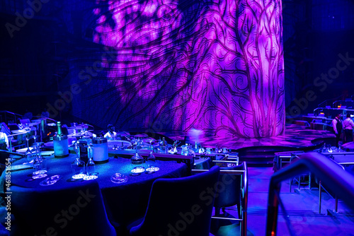 Cancun, Mexico. May 30, 2021. Table setting with wine glasses and bottle at restaurant for Cirque du soleil in Cancun photo