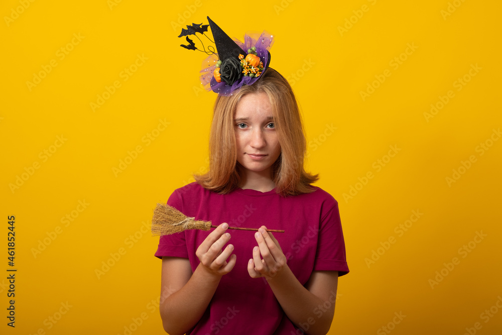 Funny young woman wearing witch costume for Halloween party. Happy Halloween. Funny young woman wearing witch costume for Halloween party. Happy Halloween.