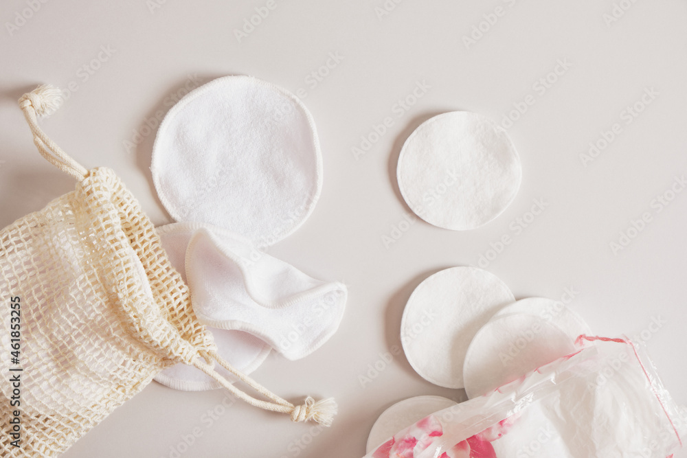 Obraz premium fabric and cotton pads for cleansing the skin from make-up, a mesh bag and a plastic bag for storing them