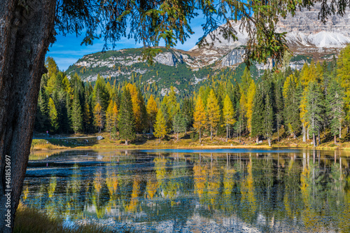 Autumn colors on the lake of Antorno. Magical glimpses of the Dolomites. Three peaks of Lavaredo