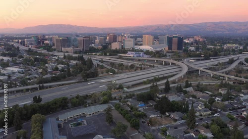Aerial Hyperlapse Of The San Jose city skyline and freeway at sunset photo