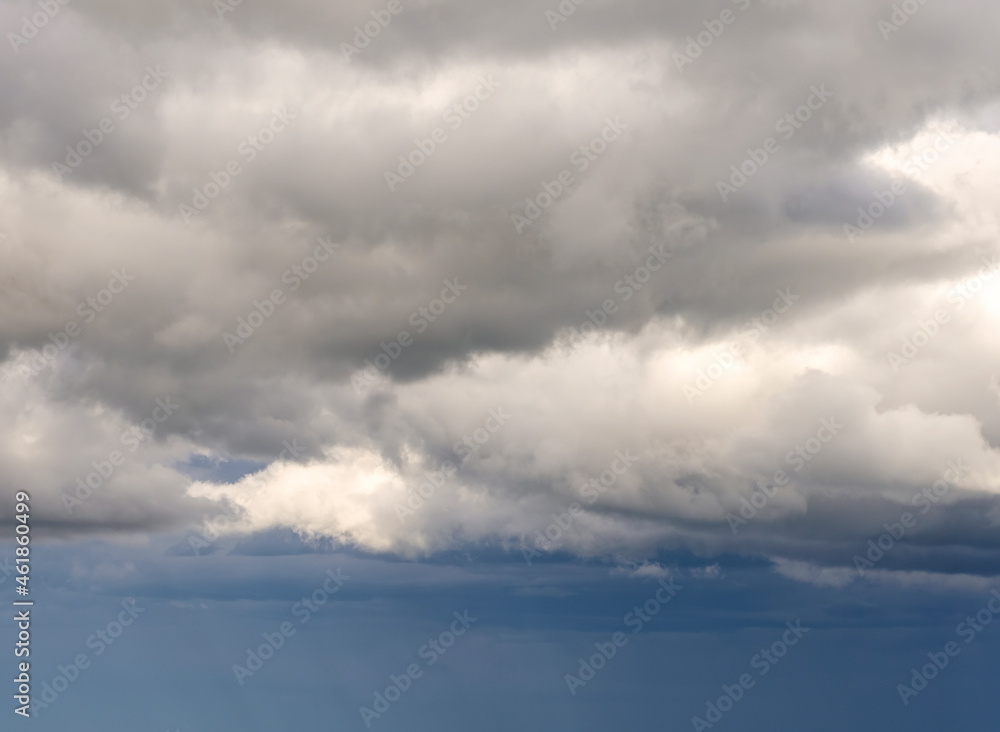 Dark and gray clouds formations in the sky. Only sky image, no land.