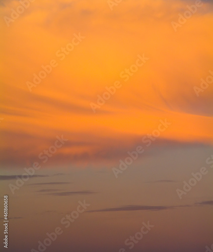 Colorful sunset sky with orange clouds. Only sky, no land.