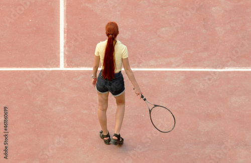The girl plays tennis on the court. Sport © schankz