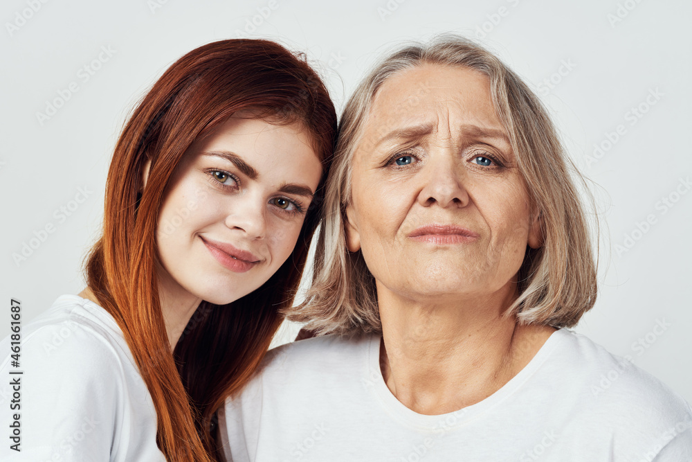 granddaughter and grandmother are standing next to family love studio granddaughter and grandmother are standing next to family love studio