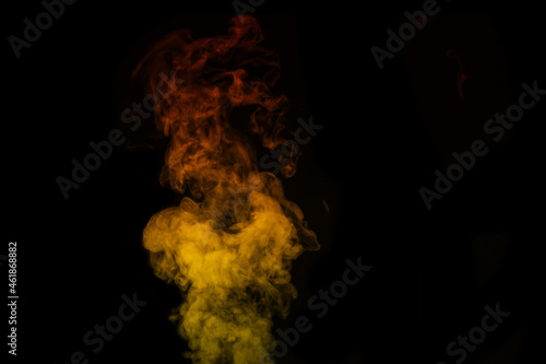 Colored orange yellow steam, smoke on a black background to superimpose on your photos.