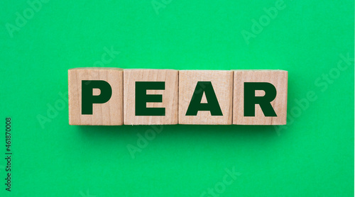 word pear spelled on wooden dice