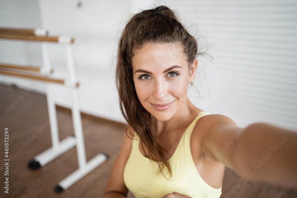 Selfie portrait instructor doing body exercises. Healthy lifestyle gymnastics and a slim figure. A woman does aerobics in a club. Selfie portrait instructor doing body exercises. Healthy lifestyle gymnastics and a slim figure. A woman does aerobics in a club.