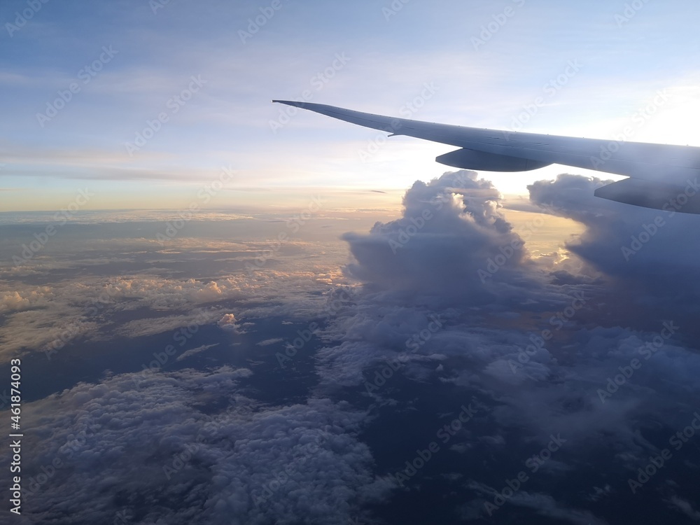 a cloudy area and sunrise from window plane a cloudy area and sunrise from window plane
