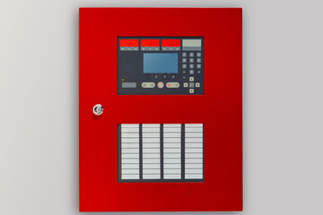 Fire panel with buttons and sensors. Red panel for fire safety control. Fire panel on a light background. Safety control equipment. Concept - sale of security control systems. Anti flame equipment