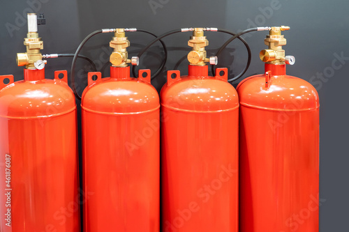 Automatic fire extinguisher system. Several cylinders for extinguishing flame. Gas cylinders for extinguishing fire. Industrial anti fire equipment. Implementation of flame extinguishing systems