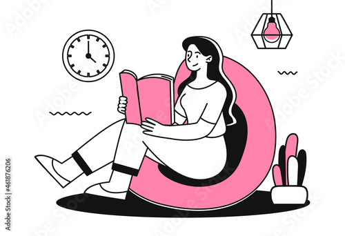 Girl sitting on couch and reading book