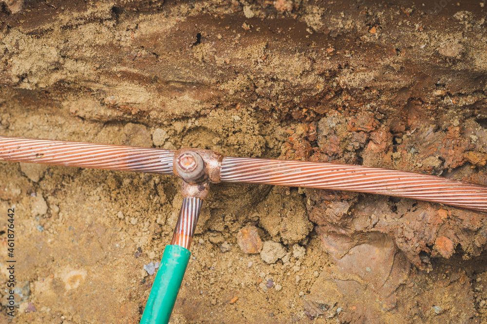 Welding copper ground wire on ground rod.Welding copper ground wire