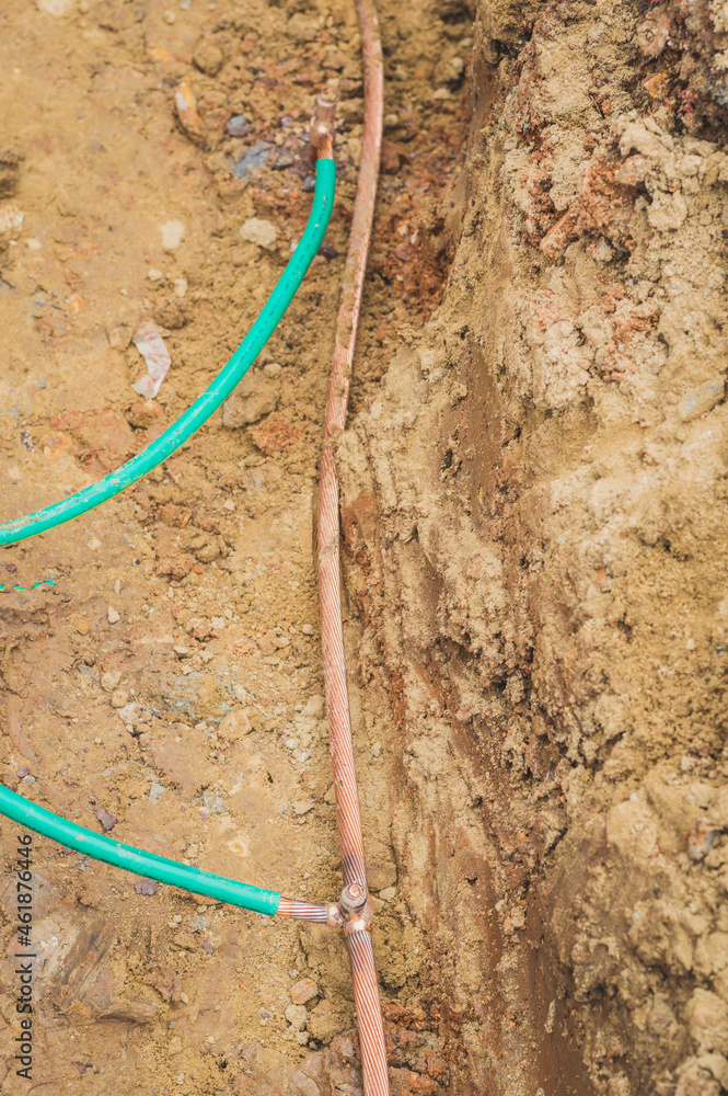 Welding copper ground wire on ground rod.Welding copper ground wire