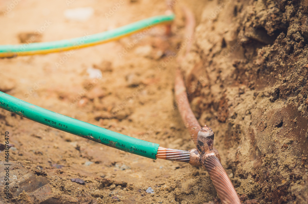 Welding copper ground wire on ground rod.Welding copper ground wire