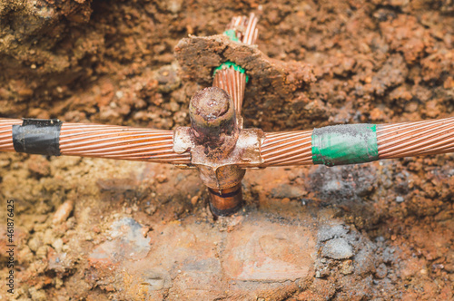 Welding copper ground wire on ground rod.Welding copper ground wire.Connect copper grounding lightning protection system. With the melting