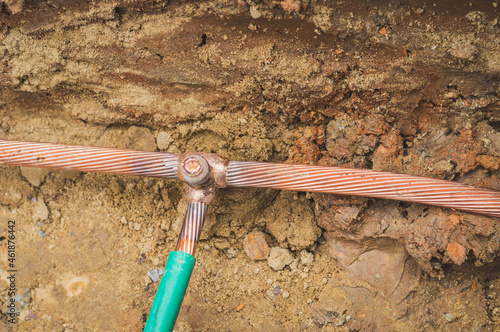 Welding copper ground wire on ground rod.Welding copper ground wire.Connect copper grounding lightning protection system. With the melting
