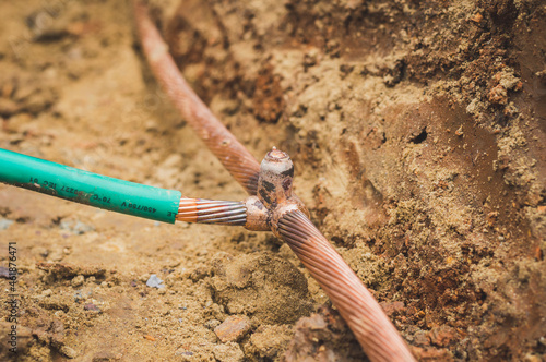 Welding copper ground wire on ground rod.Welding copper ground wire.Connect copper grounding lightning protection system. With the melting photo