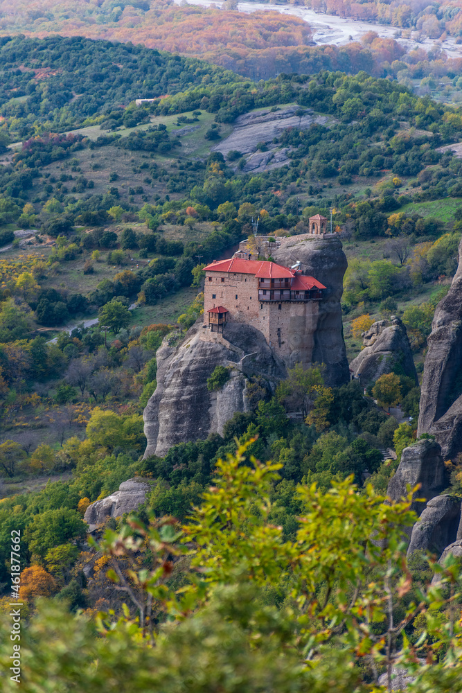 Fototapeta premium Agios Nikolaos monastery, an unesco world heritage site, located on a unique rock formation above the village of Kalambaka during fall season.