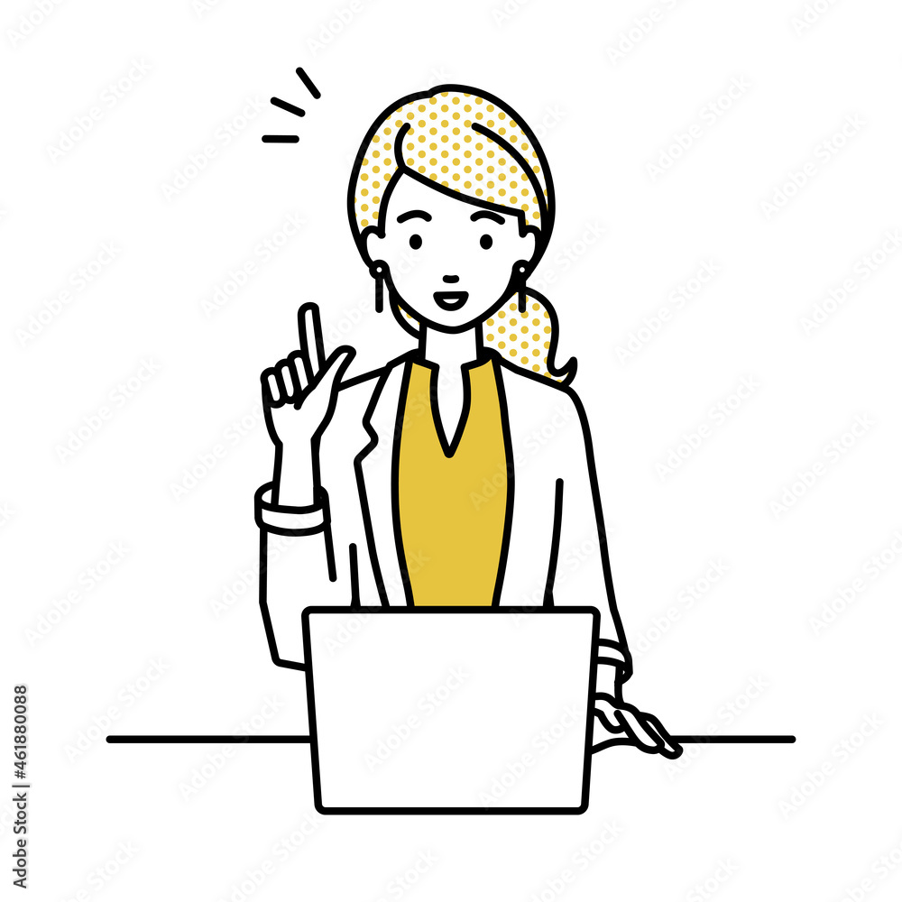 デスクで座ってPCを開いて何かひらめいたジャケットの女性