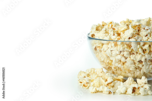 Glass bowl with popcorn isolated on white background