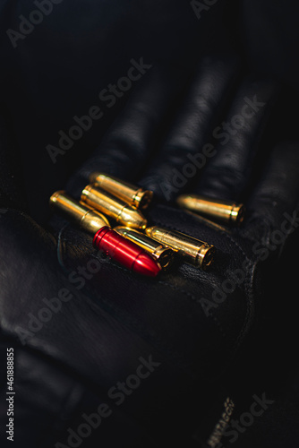 bullets on black glove photo