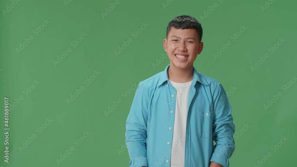 The Portrait Of A Young Asian Boy Opening His Eyes With Palms In The Green Screen Studio
The Portrait Of A Young Asian Boy Opening His Eyes With Palms In The Green Screen Studio