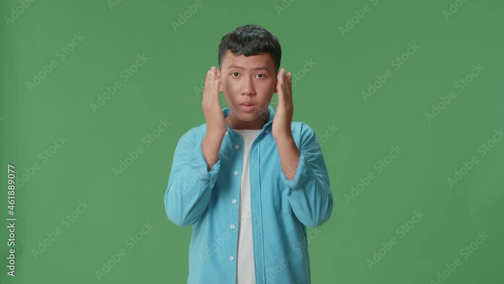 The Portrait Of A Young Asian Boy Opening Her Eyes With Palms , Surprised And Saying Wow In The Green Screen Studio
The Portrait Of A Young Asian Boy Opening Her Eyes With Palms , Surprised And Saying Wow In The Green Screen Studio