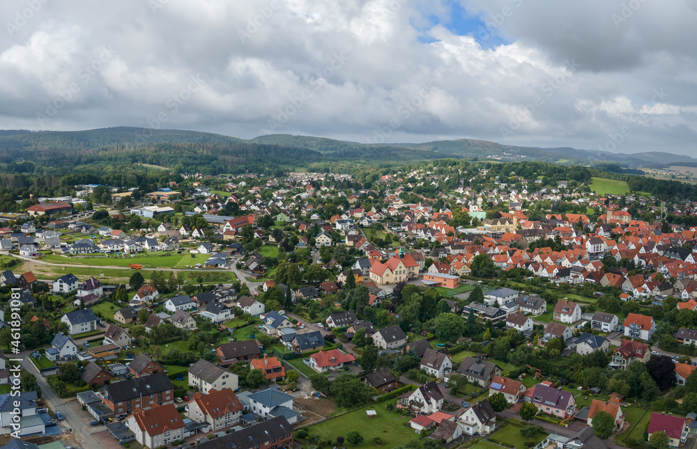 Aerial view of the center of the town of Horn in the Teutoburg Forest. In the middle is a school and on the right the town hall and the church. It's a cloudy summer day with some sunshine. Aerial view of the center of the town of Horn in the Teutoburg Forest. In the middle is a school and on the right the town hall and the church. It's a cloudy summer day with some sunshine.
