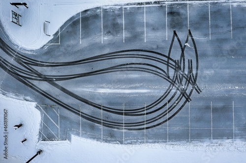 Aerial top-down view of an empty parking lot in winter season