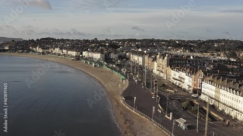 Aerial footage of Weymouth Beach and Seafront along the Esplanade of this popular English seaside resort in Dorset. photo