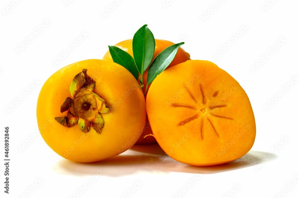 yellow ripe persimmon isolated on white background yellow ripe persimmon isolated on white background