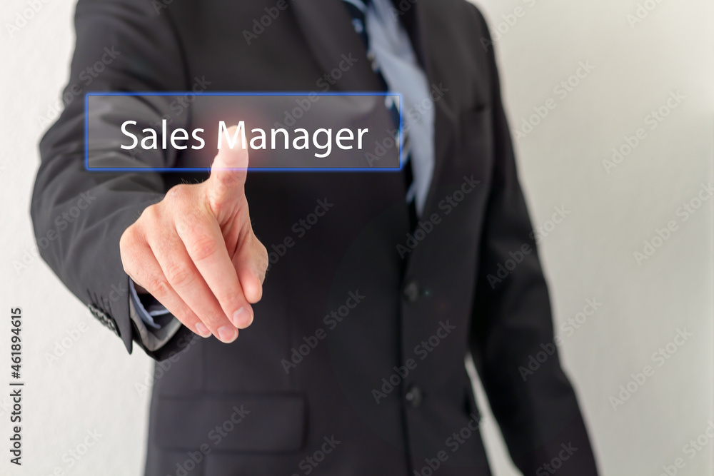 A Businessman is pressing a virtual button with the word Sales Manager A Businessman is pressing a virtual button with the word Sales Manager
