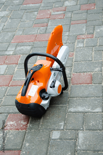Concrete cutter machinery and cutting blade on a driveway