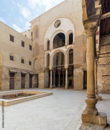 Facade of main courtyard of Mamluk era public historic mosque of Sultan Qalawun with stone pillar, Moez Street, Gamalia District, Cairo, Egypt photo